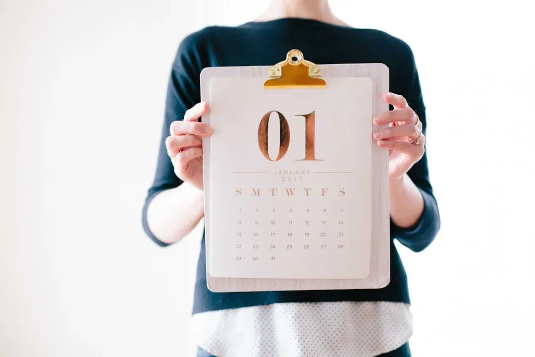 person checking calendar on phone with a concerned expression