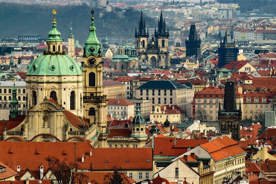 Red-tiled rooftops of Prague Old Town seen from the castle hill