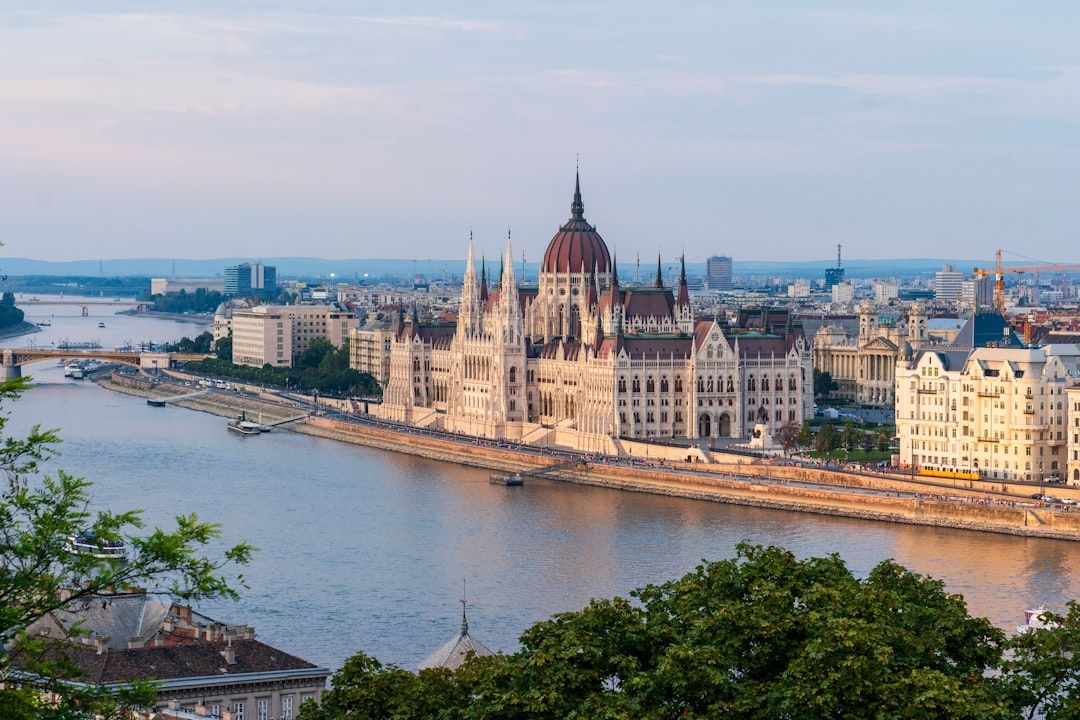 Hungarian Parliament building lit at night on the bank of the Danube in Budapest